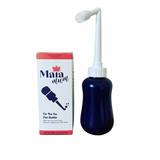 A peri bottle designed for personal hygiene, shown alongside its packaging. The bottle is dark blue with a white nozzle, and the packaging is red and white with product information.